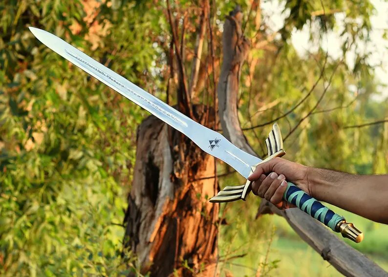 a man hand carrying Zelda sword