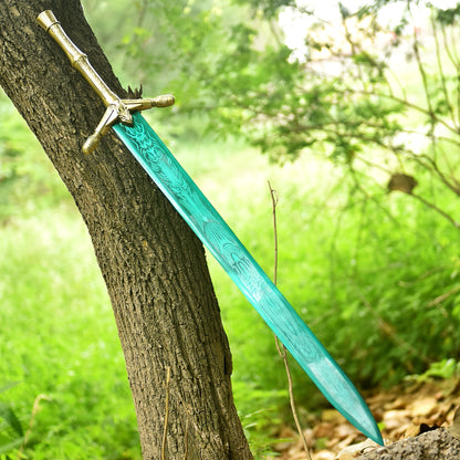 Fantasy dragon sword displayed against a tree