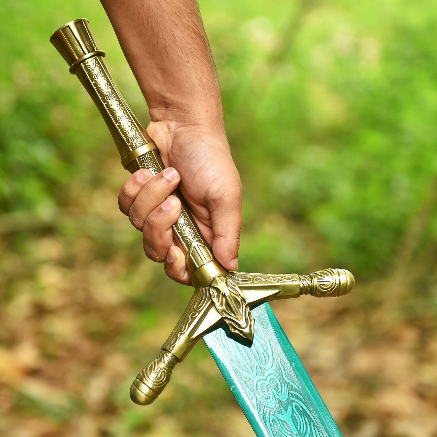 Hand holding personalized Emerald Dragon Sword