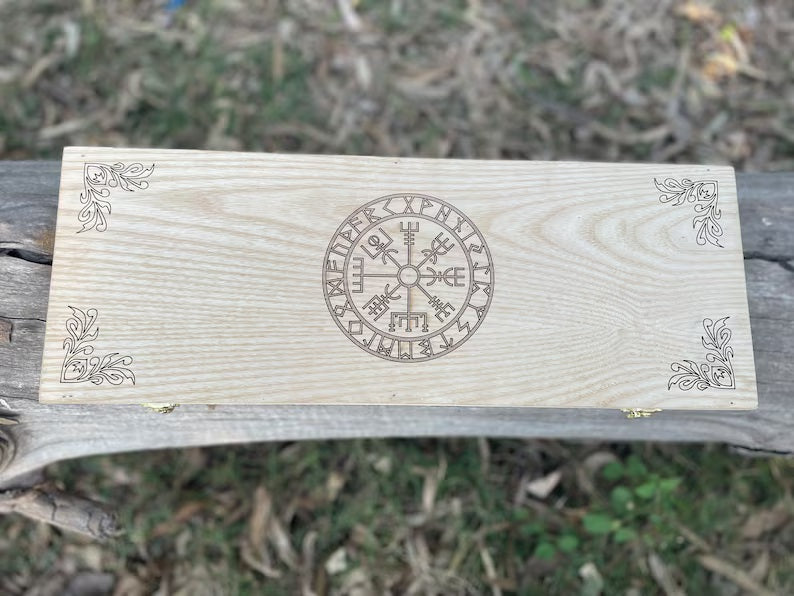Wooden plaque with a engraved symbol on a natural background