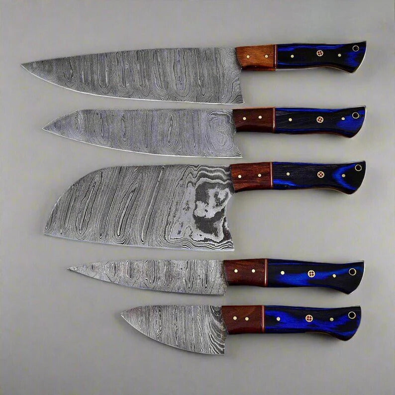 Set of five knives with damascus steel blades and colorful handles on a light gray background