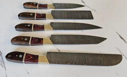 Set of five knives with decorative handles on a light background