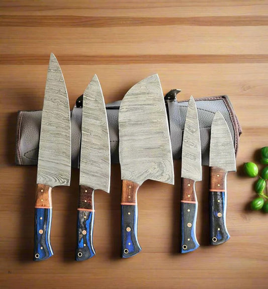 Set of five knives with wooden handles on a wooden surface