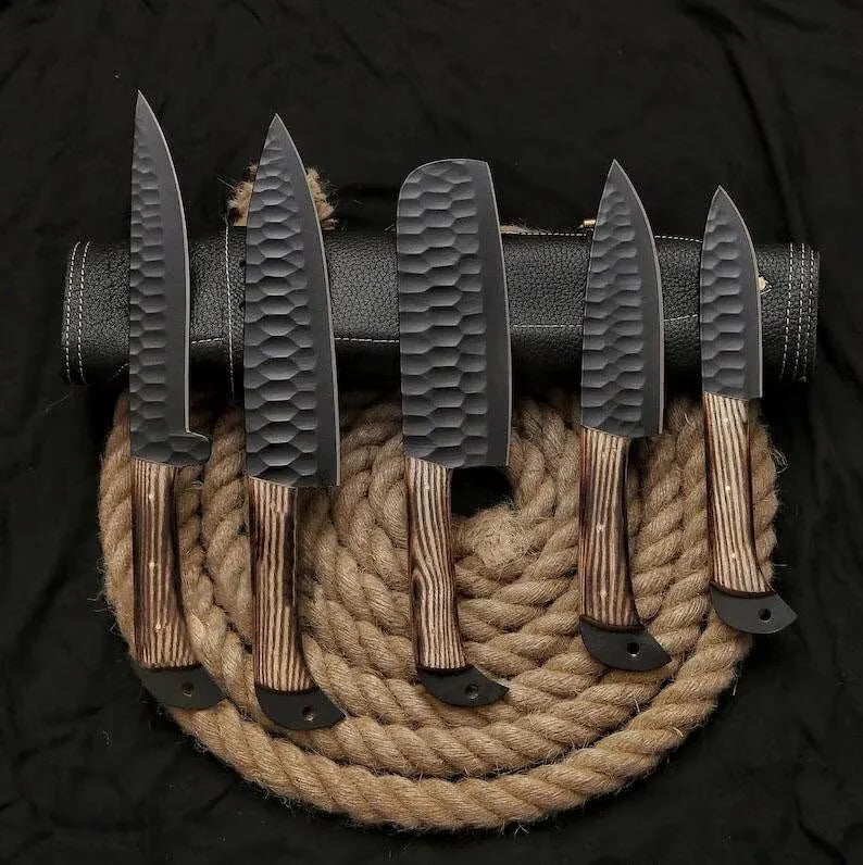 Set of knives with wooden handles on a black background