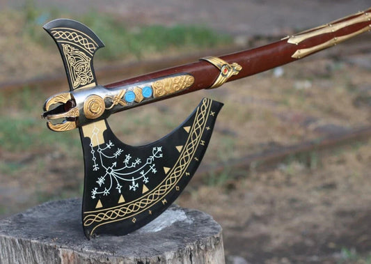 Decorative Kratos Leviathan Viking Axe with intricate designs on a wooden stump