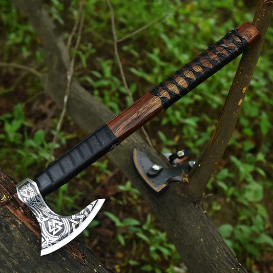 Decorative Ragnar Viking Axe with a wooden handle and metal head on a tree branch