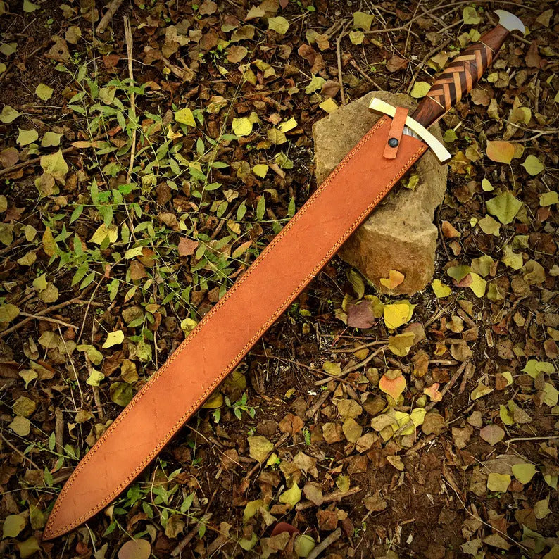 Sword with leather sheath on a natural ground background