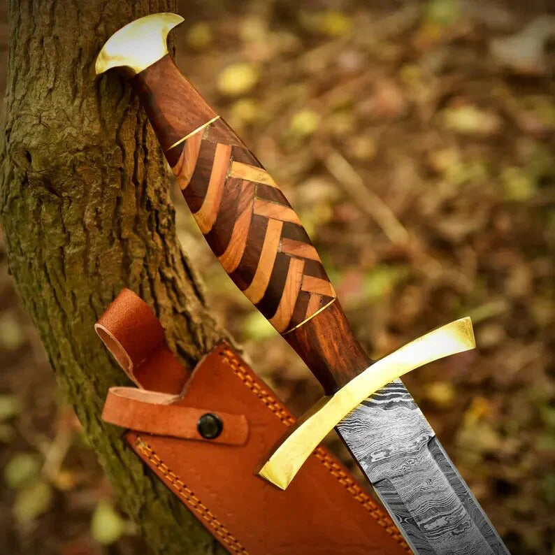 Wooden sword with gold blade and leather sheath against a natural background