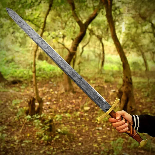 Person holding a large sword in a forest setting