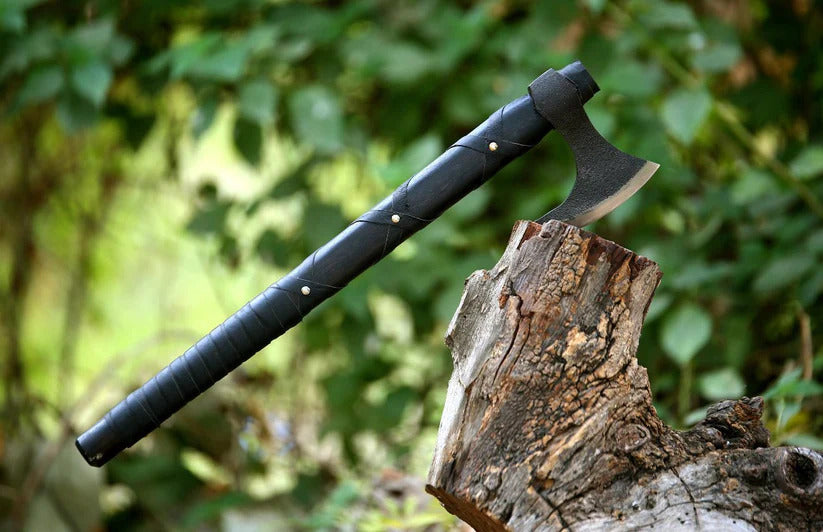 Front view of hand-forged Ragnar Lothbrok Viking Axe placed on wooden surface