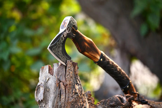 Front view of Single handed bearded axe placed on wooden surface