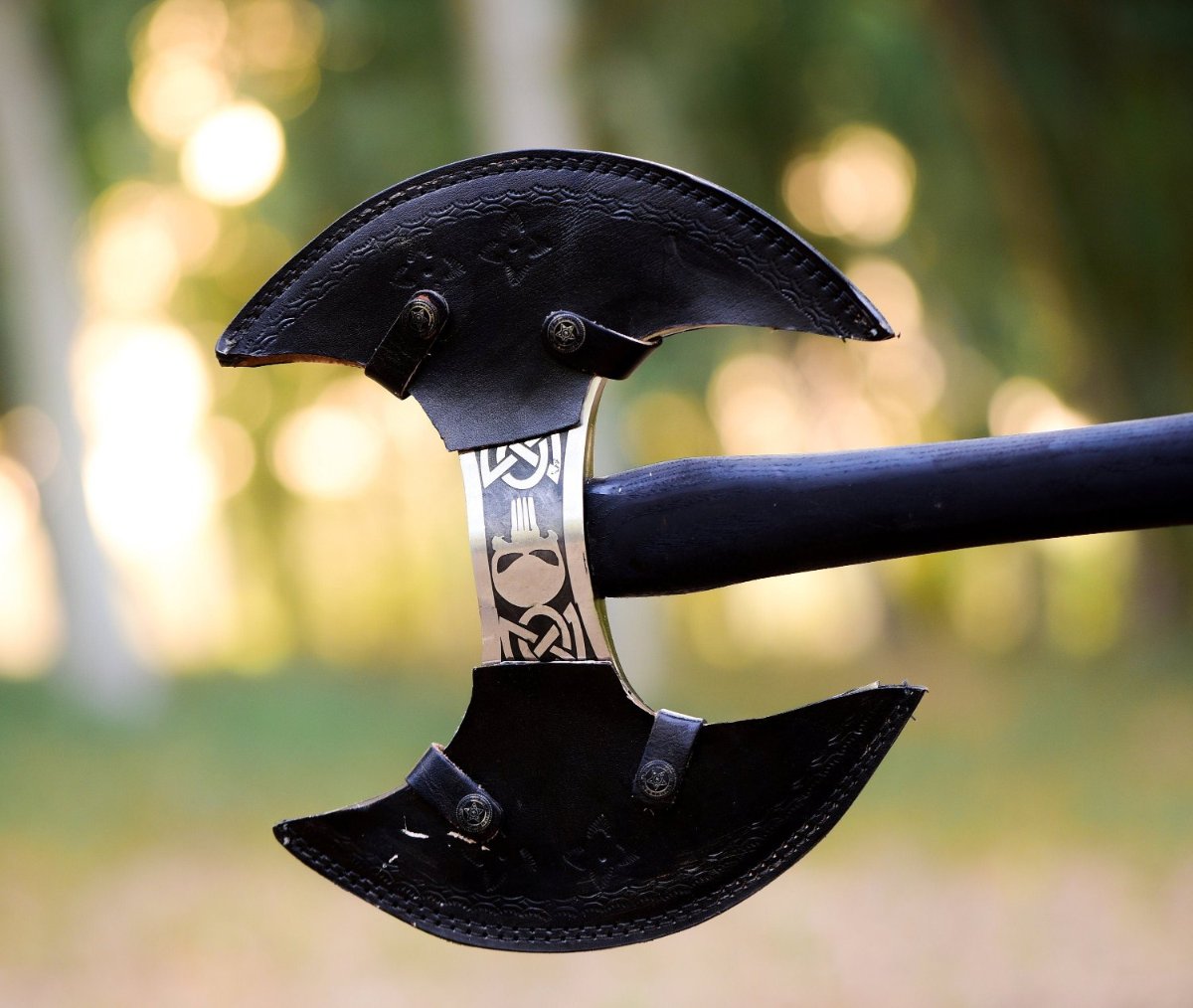 shop double headed viking axe with black leather sheath. custom engravings available